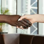 two people shaking hands - blog on how how a chief of staff improves your organization and life