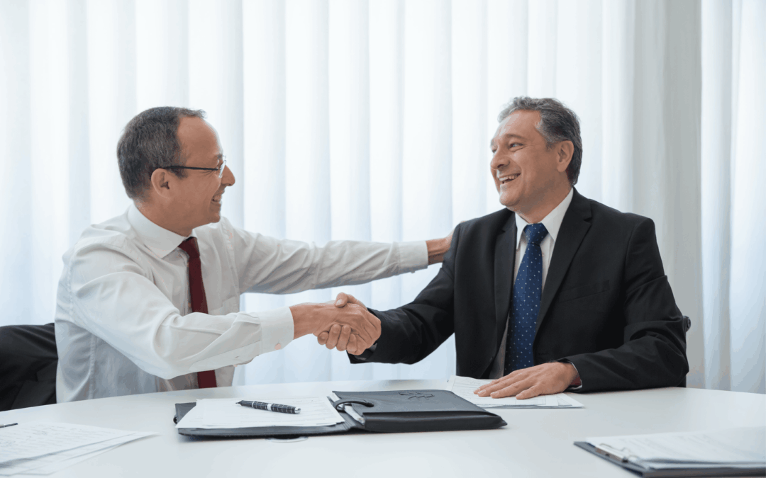 two businessmen negotiating the sale of a business