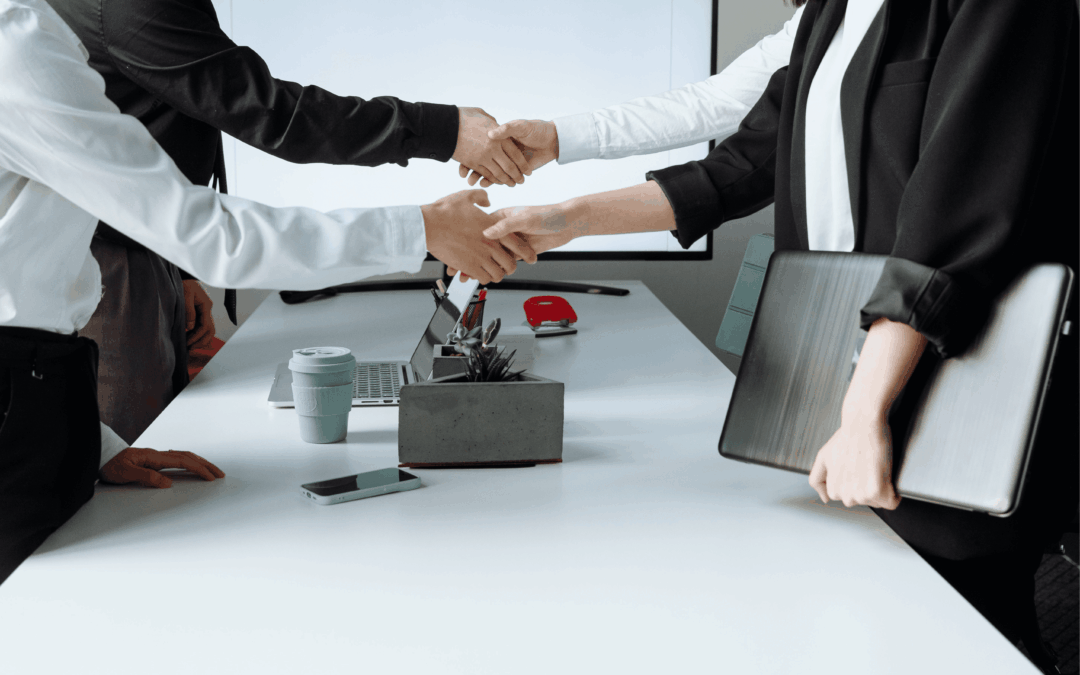 The business seller's team is armed with negotiation strategies as they discuss the terms of the business sale with the buyer.