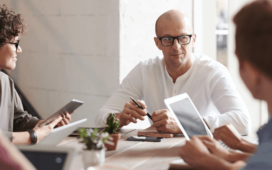 A founder in a close meeting with his trusted advisors.